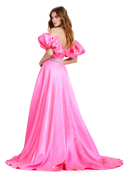 Elevate your formal look with the Ashley Lauren 11474 Long Prom Dress. This elegant strapless satin ball gown boasts a beaded belt, detachable puff sleeves, and a timeless pageant-style design. Perfect for making a statement at any event, this dress exudes sophistication and style. Be memorable in this strapless satin ball gown. This dress features a beaded belt detail, a left leg slit and detachable puff sleeves.