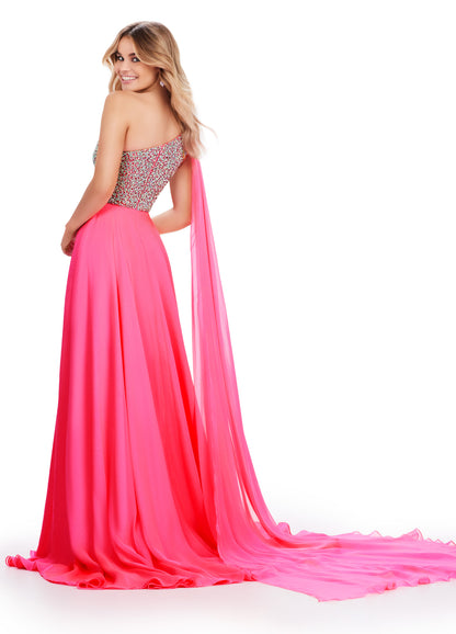 Introducing the show-stopping Ashley Lauren 11482 Long Prom Dress! This elegant gown features a one-shoulder design and flowing chiffon fabric, perfect for any formal occasion. The stunning beaded bustier adds a touch of sparkle and glamour, making you the center of attention. Elevate your style with this must-have pageant gown. A dress fit for a queen!