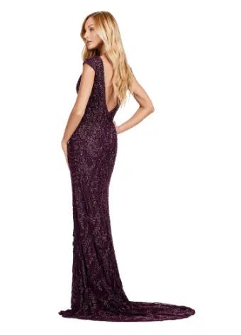 Elevate your formal style with the Ashley Lauren 11497 Fully Beaded V-Neck Evening Gown. The intricate beading, cap sleeves, and center slit create a stunning silhouette that will surely make a statement. Perfect for special occasions, this gown exudes elegance and sophistication. This fully beaded gown is perfect for your next event. This elegant dress features cap sleeves and a V-Neckline with a center slit to compliment the look.