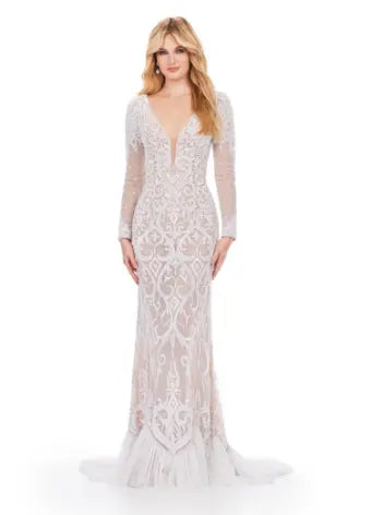 This elegant Ashley Lauren 11507 Long Prom Dress features a long sleeve beaded gown with an illusion open back, perfect for formal occasions and pageants. The intricate beading adds a touch of luxury while the open back adds a hint of allure. Make a statement with this stunning dress. his classic long sleeve fully beaded gown features a v neckline and illusion open back. The details on the train complete the look.