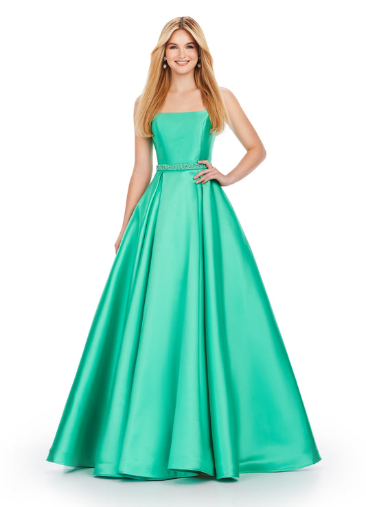 Be the belle of the ball in the Ashley Lauren 11540 Long Prom Dress. This elegant spaghetti strap mikado ball gown features beaded straps and a flattering belt, perfect for your next formal event or pageant. Expertly designed for a stunning and sophisticated look. Dare to be remembered in this one shoulder gown with elegant draping. The fitted skirt is complete with a side skirt that is sure to turn heads. The unique lace up back is sure to provide an exceptional fit.