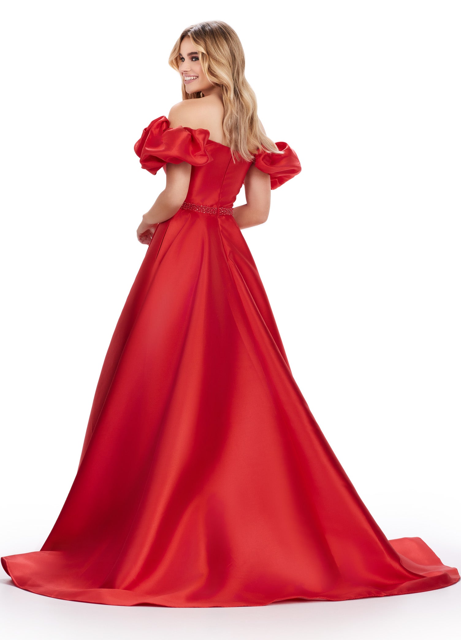 Elevate your prom night look with the Ashley Lauren 11542 long prom dress. Featuring an off-shoulder neckline and a gorgeous ball gown silhouette, this formal pageant gown is crafted from Mikado fabric for a luxurious feel. The puff sleeves add a playful touch, making you stand out from the crowd. Off the shoulder Mikado ball gown with puff sleeve details. The look is complete with a beaded waistline.