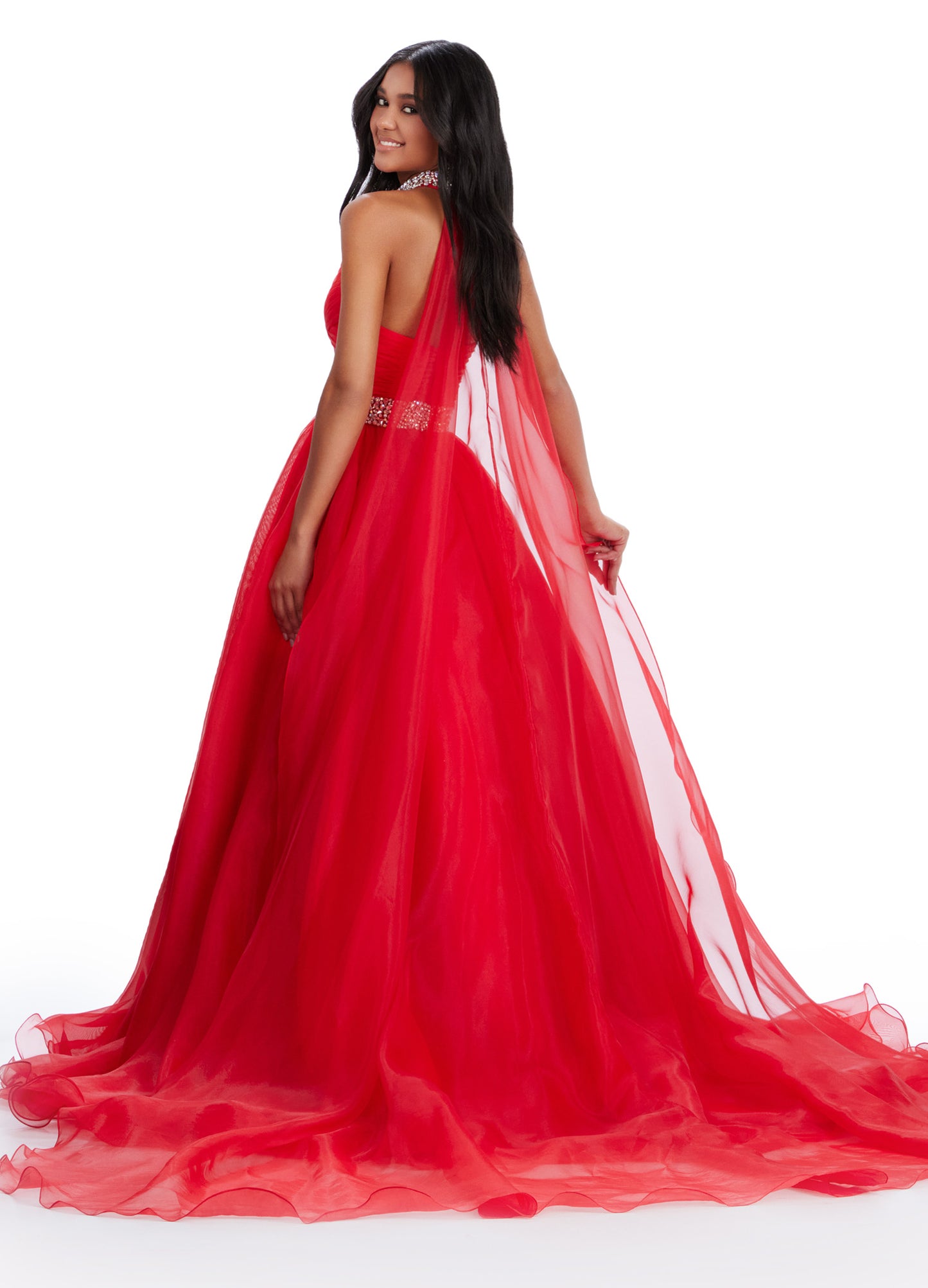 The Ashley Lauren 11565 Long Prom Dress is a stunning organza ball gown that features a beaded choker and a flowing cape, perfect for formal events or pageants. With its intricate beading and elegant design, this dress will make you feel like a true princess. A dress sure to make you feel like a queen. This strapless organza ball gown features a beaded waist band. The look is finished with a beaded choker and organza cape.