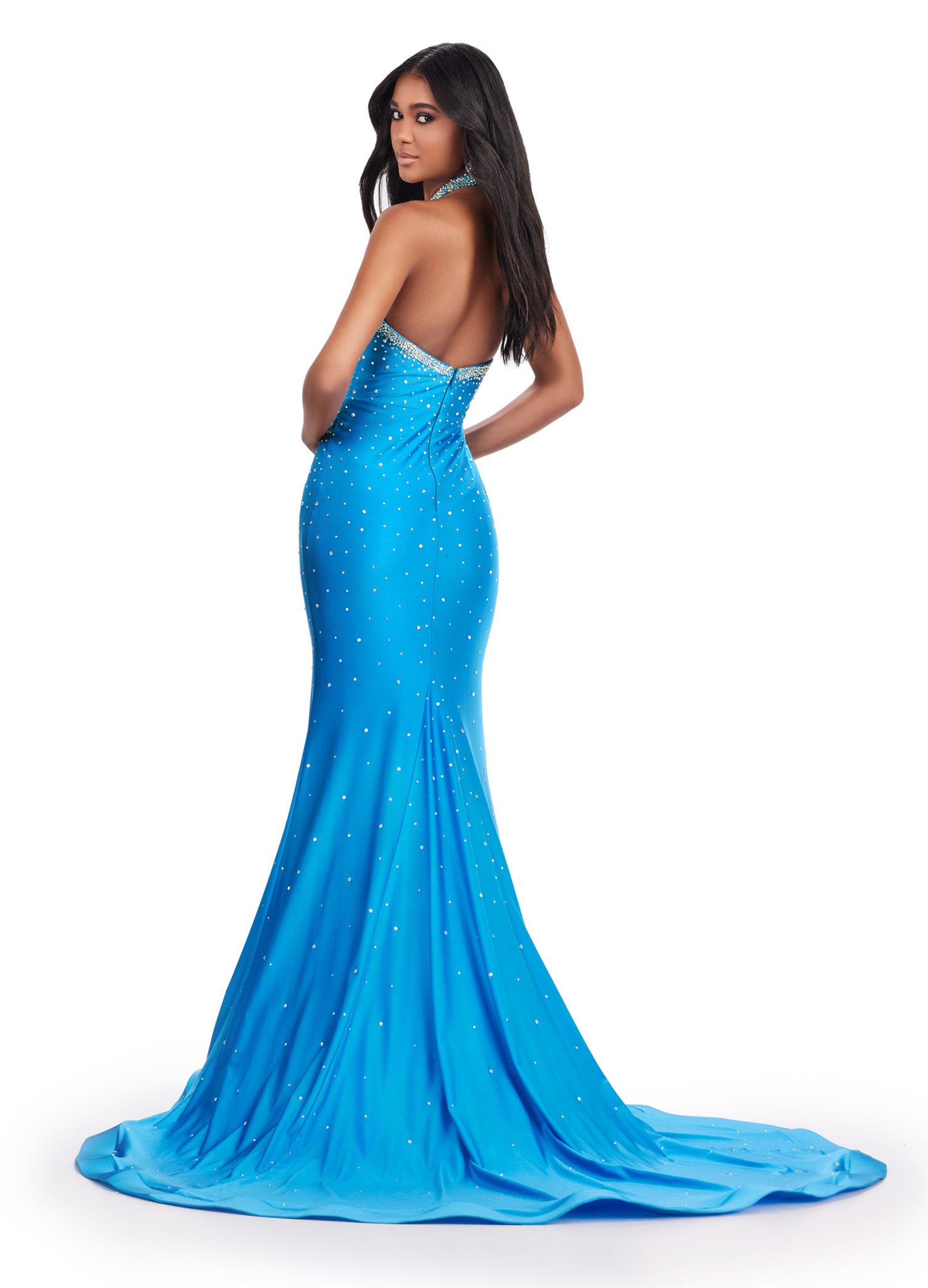 Be the star of the prom with the Ashley Lauren 11578 Long Prom Dress. Designed with a mermaid silhouette and cut-outs, this elegant gown is made of high-quality jersey fabric. The dress also features press on stones, adding a touch of glamour. Perfect for formal events and pageants. Dance the night away in this edgy and fabulous jersey gown. This dress features a halter design with cut outs and press on stones make this dress stand out.
