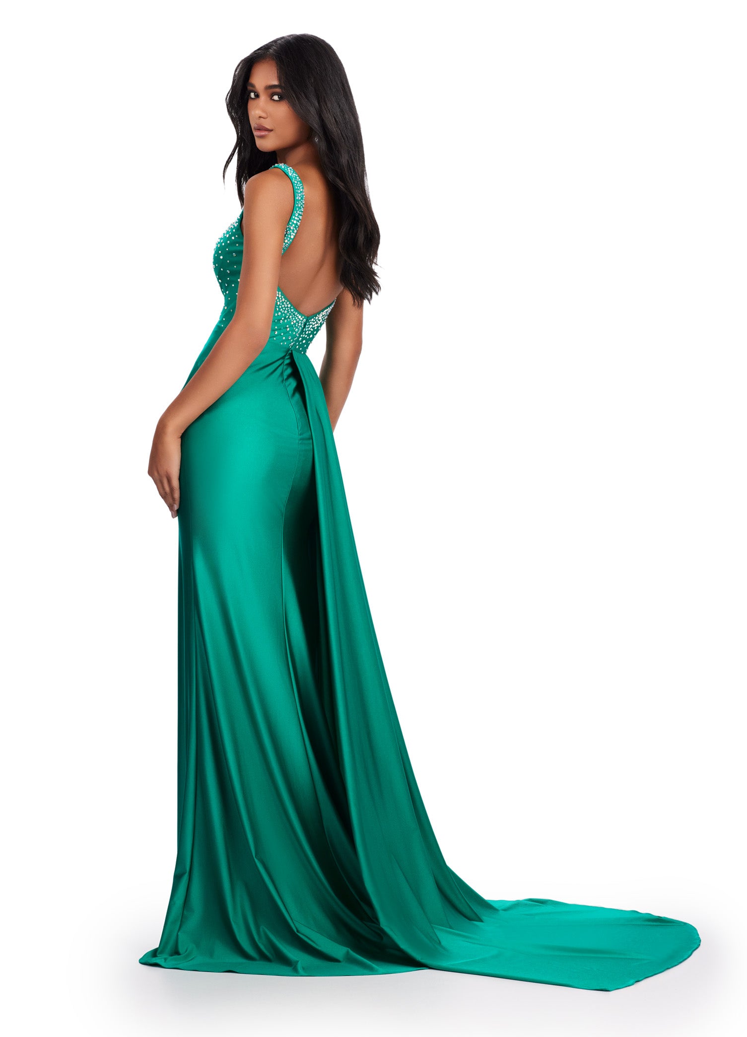 Elevate your formal look with the Ashley Lauren 11579 Long Prom Dress. Made with jersey fabric, this gown features press-on stones and a side skirt slit for added glamour. Perfect for pageants or prom, this dress will make you stand out on any occasion.This unique jersey gown features press on stones and a fabulous side skirt. Perfect for your next event!