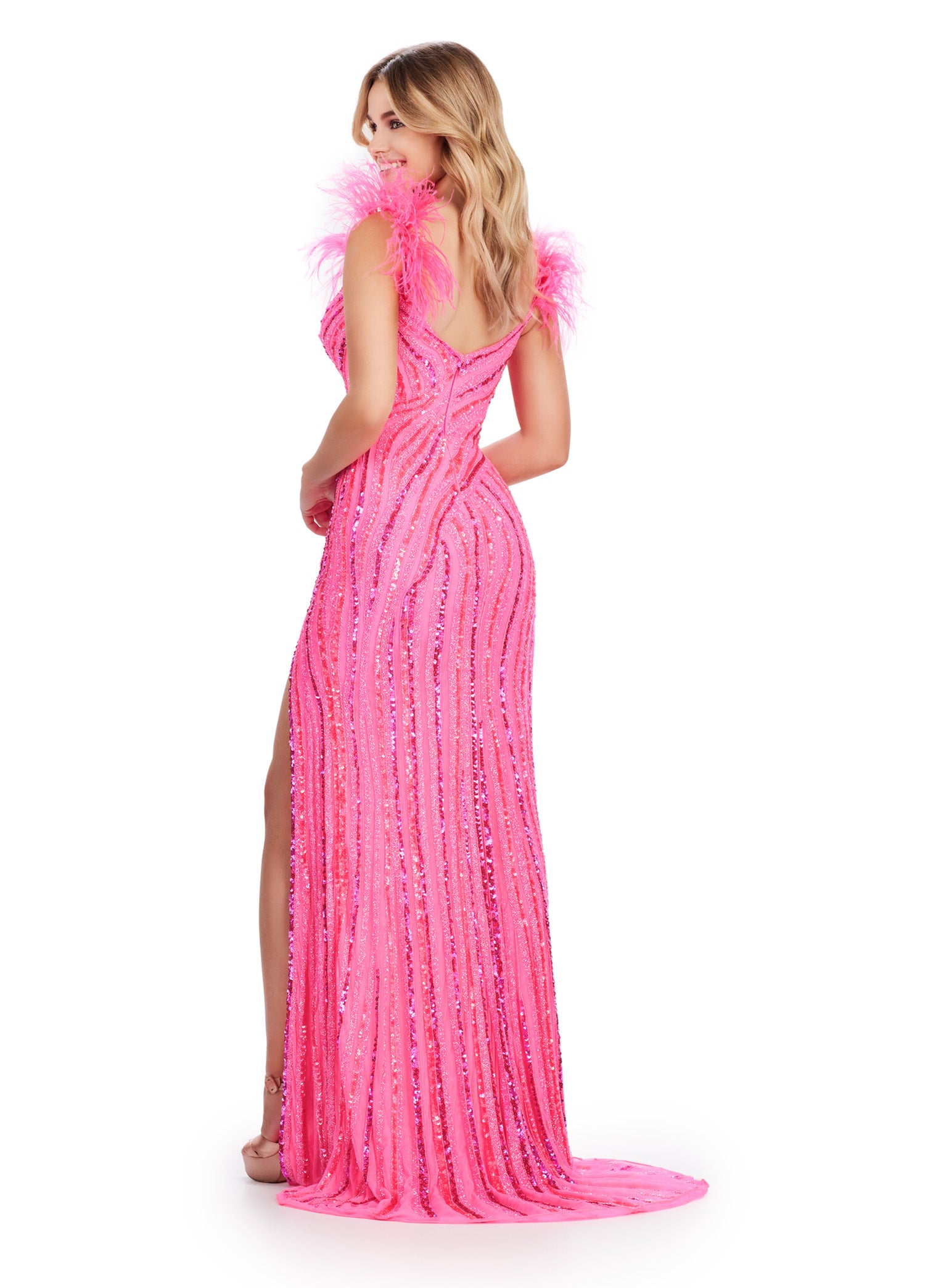 Elevate your style with the Ashley Lauren 11586 Long Prom Dress. This fully beaded dress features feather straps and a formal, pageant-worthy design. With its exquisite detailing and elegant silhouette, this dress will make you stand out and feel confident at your next special event. So glam! This style features a v-neckline complete with feather shoulder details. Intricate beading is scattered throughout the gown.