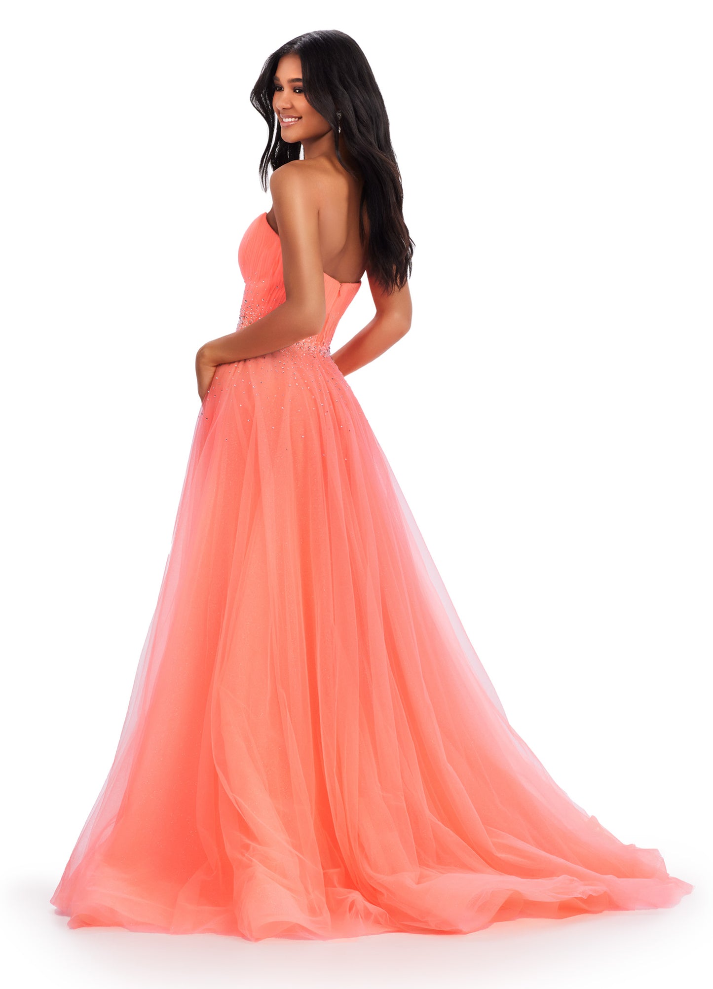 Expertly crafted by Ashley Lauren, this 11597 Long Prom Dress exudes timeless elegance. The strapless design coupled with glittery tulle creates a stunning ball gown silhouette. Adorned with a beautiful beaded belt, this formal pageant gown is a perfect choice for any special occasion. The perfect dress fit for a princess. This strapless glitter tulle ball gown features a beaded waist detail that'll be sure to make you sparkle at your next event!