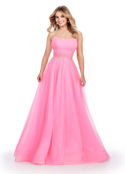 Expertly crafted by Ashley Lauren, this 11597 Long Prom Dress exudes timeless elegance. The strapless design coupled with glittery tulle creates a stunning ball gown silhouette. Adorned with a beautiful beaded belt, this formal pageant gown is a perfect choice for any special occasion. The perfect dress fit for a princess. This strapless glitter tulle ball gown features a beaded waist detail that'll be sure to make you sparkle at your next event!