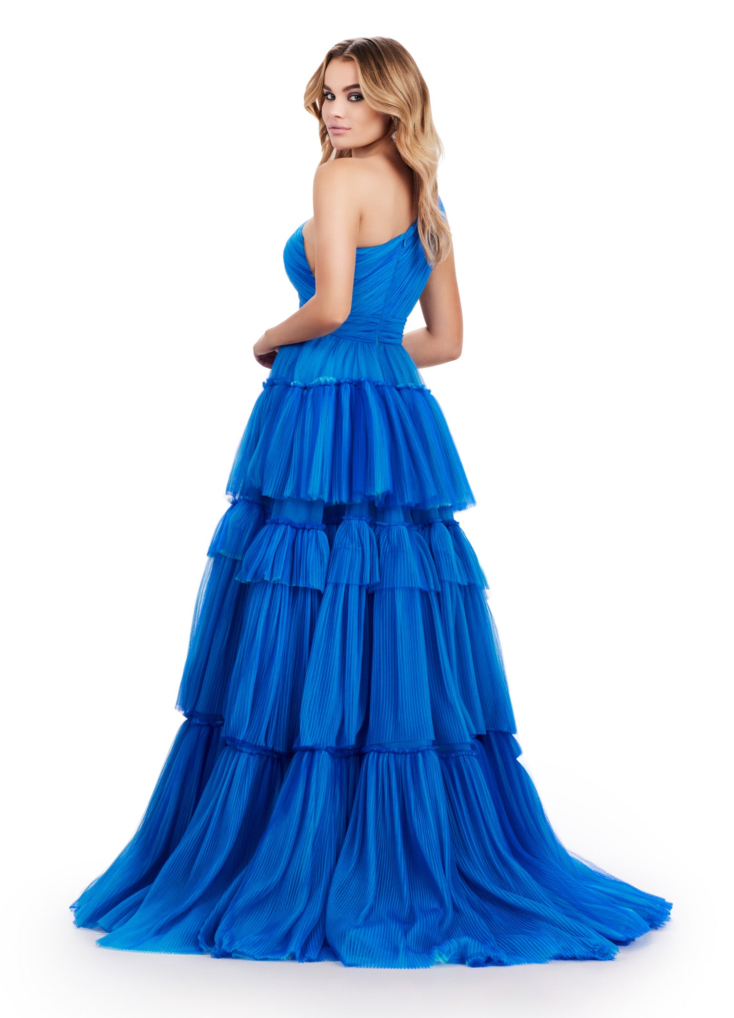 Turn heads at prom or pageants with the Ashley Lauren 11619 Long Prom Dress. This stunning two-tone tiered tulle ball gown features a sleek left leg slit, adding a touch of elegance to your look. Expertly crafted with top-quality materials, this dress is perfect for making a statement and feeling confident. Tiered dreams! This two-tone tired tulle ball gown features a one shoulder design and a left leg slit.