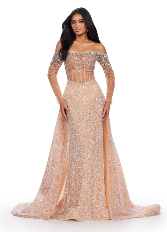 Experience glamour like never before with the Ashley Lauren 11636 long prom dress. The off-shoulder design and corset bustier provide a flattering, figure-hugging fit while the long sleeves add a touch of elegance. Complete with an overskirt for added drama, this formal pageant gown is perfect for making a statement at your next special occasion. Make an entrance in this off the shoulder beaded gown with sheer corset bustier. 