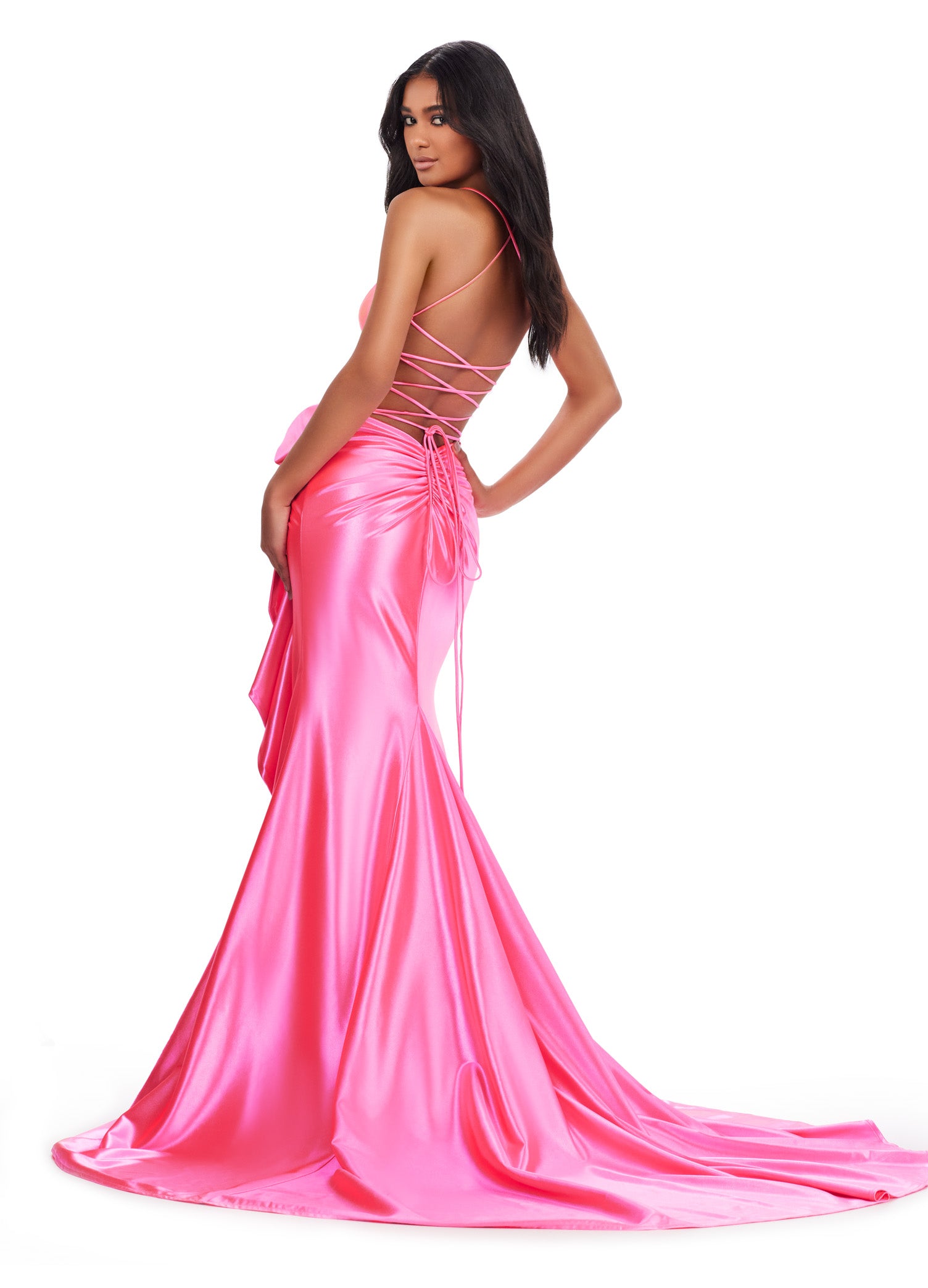 Be the belle of the ball in the Ashley Lauren 11638 Long Prom Dress. Featuring a corset top and spaghetti straps, this stunning gown exudes elegance. The cascading bow and ruffle details add a touch of drama, making it the perfect choice for any formal event or pageant. Edgy and fabulous! This shimmer jersey gown features a corset bodice with a bow and cascading ruffle detail. The lace up back and spaghetti straps make this extra fab.