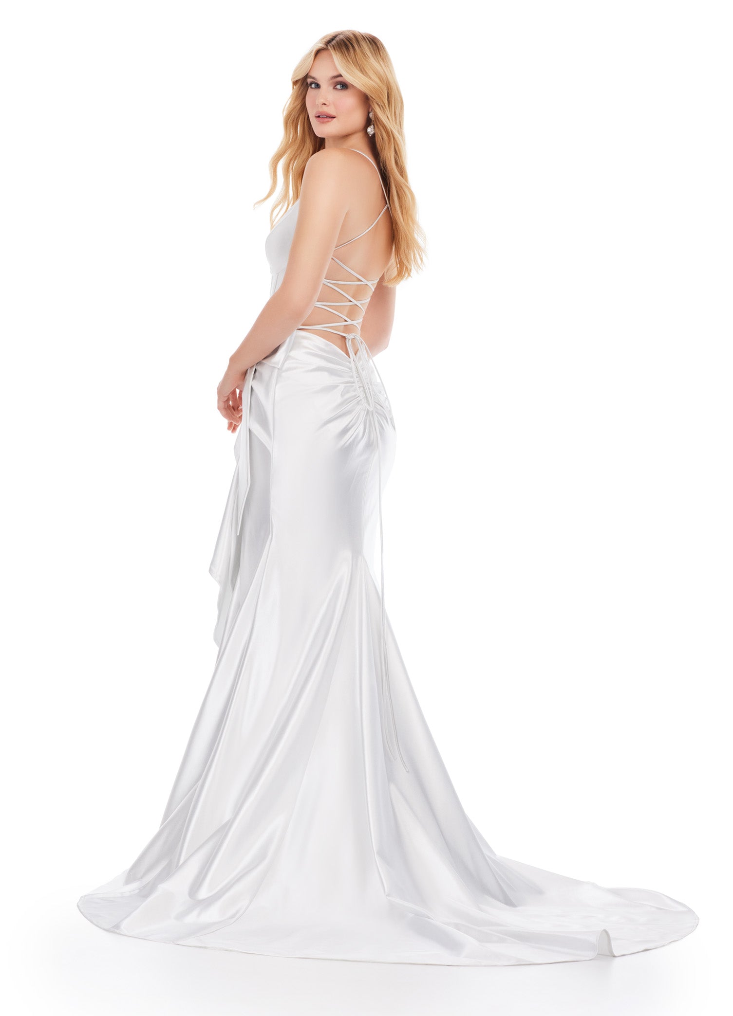 Be the belle of the ball in the Ashley Lauren 11638 Long Prom Dress. Featuring a corset top and spaghetti straps, this stunning gown exudes elegance. The cascading bow and ruffle details add a touch of drama, making it the perfect choice for any formal event or pageant. Edgy and fabulous! This shimmer jersey gown features a corset bodice with a bow and cascading ruffle detail. The lace up back and spaghetti straps make this extra fab.