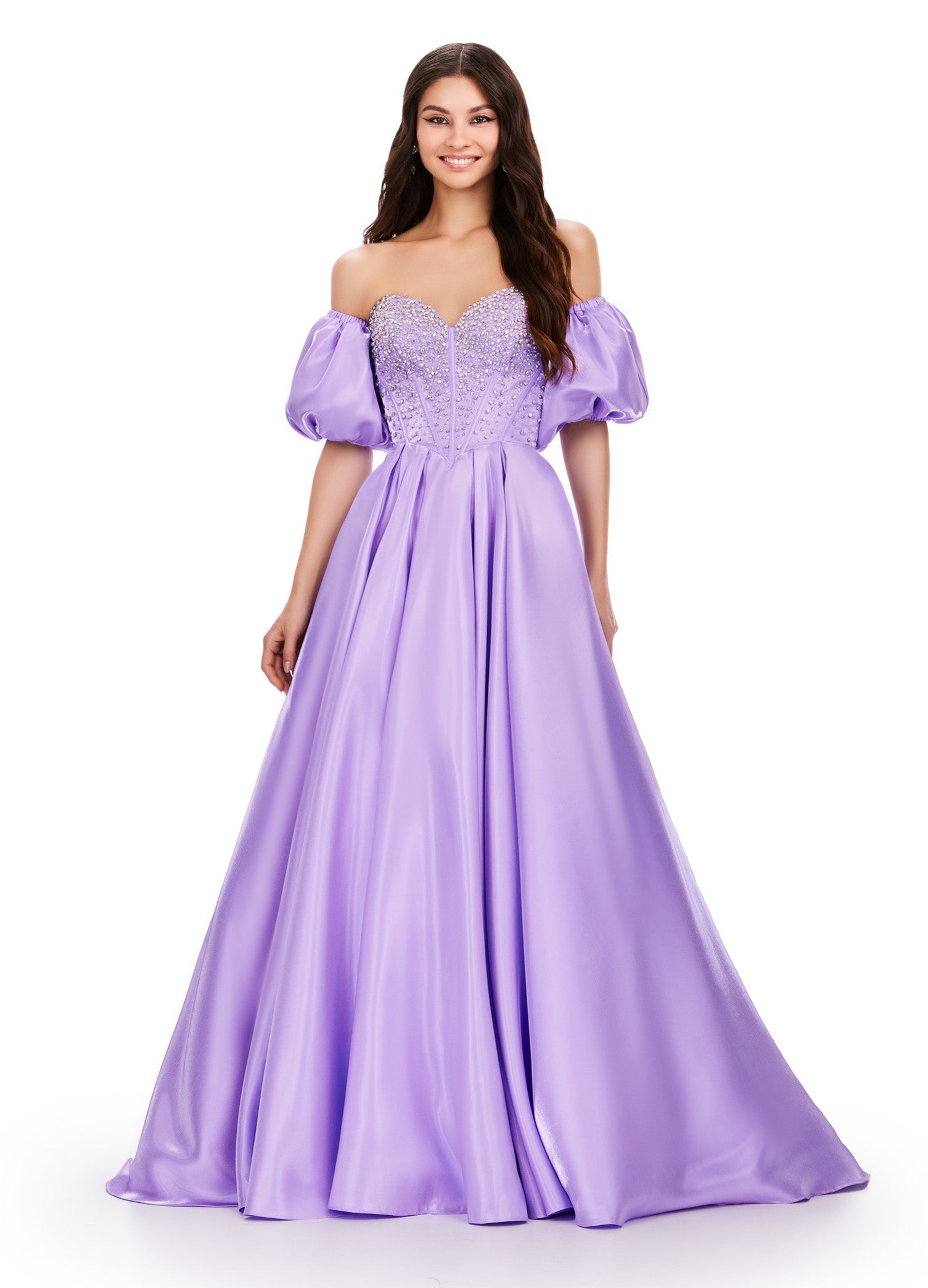 Elevate your formalwear with the Ashley Lauren 11642 prom dress. The luxurious satin fabric, sweetheart neckline, and crystal corset add elegance and charm to this A-line ballgown. The puff sleeves bring a touch of drama and playfulness to your look. Perfect for prom or pageants. A satin ball gown fit for a queen. This strapless dress features a beaded corset bodice with detachable puff sleeves and a lace up back.