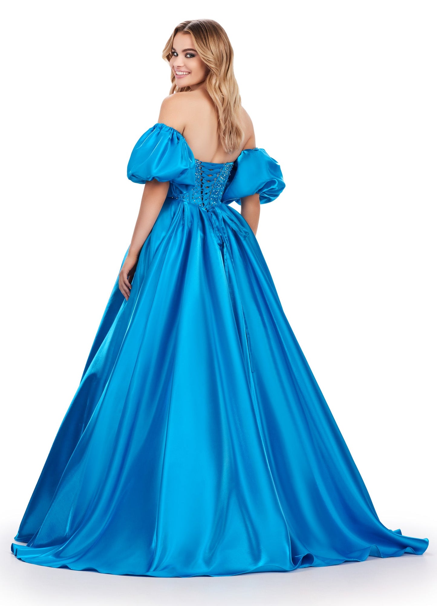 Elevate your formalwear with the Ashley Lauren 11642 prom dress. The luxurious satin fabric, sweetheart neckline, and crystal corset add elegance and charm to this A-line ballgown. The puff sleeves bring a touch of drama and playfulness to your look. Perfect for prom or pageants. A satin ball gown fit for a queen. This strapless dress features a beaded corset bodice with detachable puff sleeves and a lace up back.