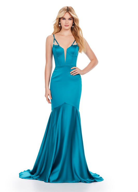 Achieve a stunning look in the Ashley Lauren 11644 Long Prom Dress. With a mermaid silhouette, corset bodice, and spaghetti straps, this formal gown is both flattering and elegant. Adorned with intricate beaded details, it's the perfect choice for prom or pageants. Make a statement and turn heads with this exquisite dress. Classy and timeless! This satin spaghetti strap gown features a corset bustier and beaded details on the straps.