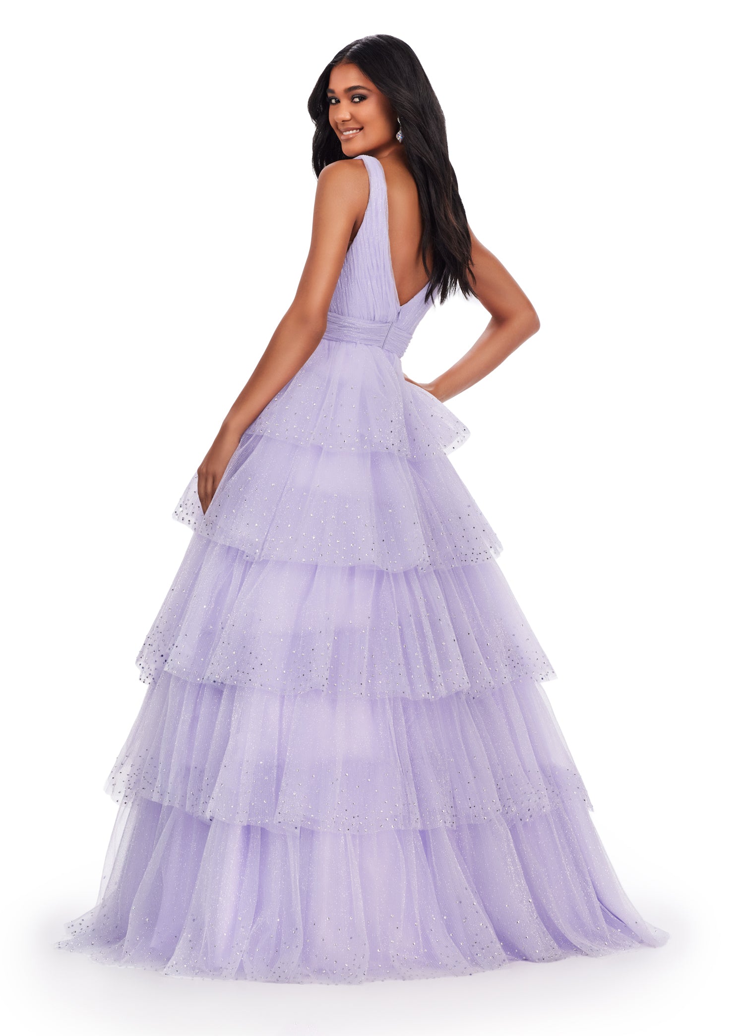 Ashley Lauren 11672 Long Layered Tulle Crystal Ball Gown Prom Dress Formal Pageant You are sure to stand out in this glitter tulle v-neckline ball gown! The glitter tulle is sure to sparkle with the added heat-set stones throughout the multi-tiered skirt.  COLORS: Lilac, Sky, Black, Hot Pink Sizes: 00-24 V-Neckline V-Back A-Line Tiered Ruffle Skirt