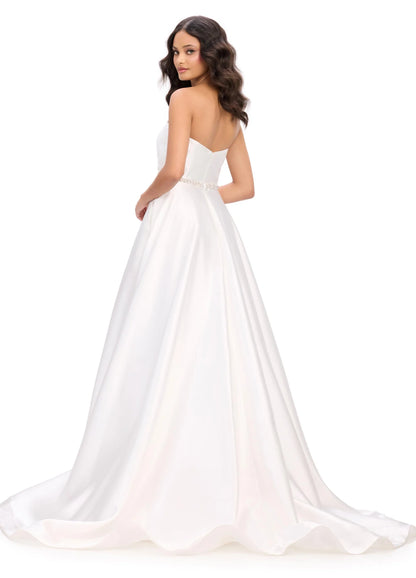 Elegant and sophisticated, the Ashley Lauren 11773 Strapless Ballgown is perfect for any formal occasion. The ruched bodice and crystal belt add subtle details, while the strapless design allows for comfortable wear. Made with high quality materials, this dress is sure to make a statement.
