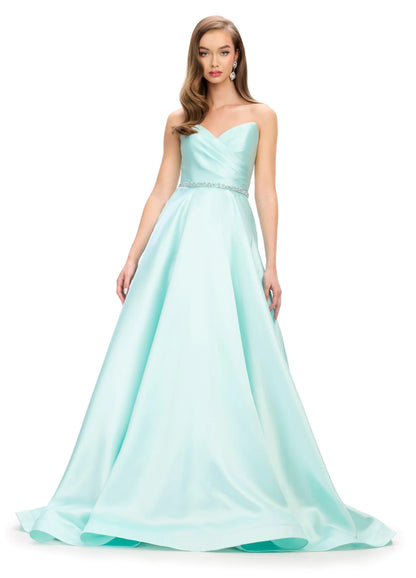Elegant and sophisticated, the Ashley Lauren 11773 Strapless Ballgown is perfect for any formal occasion. The ruched bodice and crystal belt add subtle details, while the strapless design allows for comfortable wear. Made with high quality materials, this dress is sure to make a statement.
