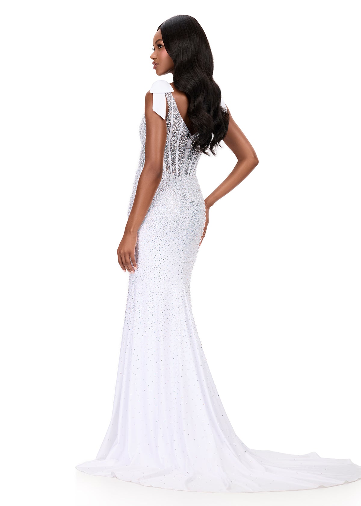 Make them stop and stare in this stunning ASHLEYlauren Style 12179 pearl jersey gown. This fitted dress features elegant bow shoulder straps, a flattering square neckline, and a v-back for a touch of sophistication. The intricate beadwork cascades beautifully down the gown, highlighting your figure and finishing with a dramatic sweep train—perfect for prom, pageant, or evening events.

Available in Red, Sky, White, Ice Pink, and Black
Perfect for Galas, Black Tie Formals, Prom, and Special Occasions
Fitted 