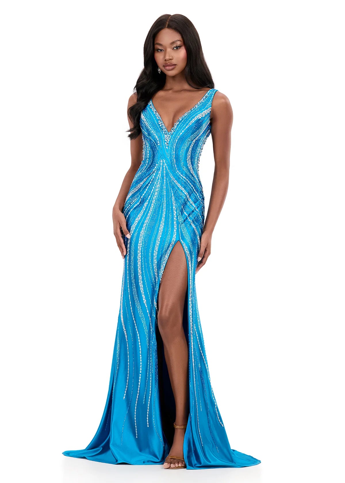 Make a statement in ASHLEYlauren Style 12253. This fully beaded evening gown features a flattering v-neckline and fitted silhouette. The heat set stone pattern creates a stunning swirl effect that accentuates your curves. The look is finished with a high slit and low open back for added drama.

Available in Champagne, Emerald, Ocean, Pink, Purple, Red, Royal
Ideal for Prom, Formal Galas, Special Occasions, Pageant Competitions and Red Carpet Events.
Featuring a V-Neckline, High Slit, and Open Back

Ashley L