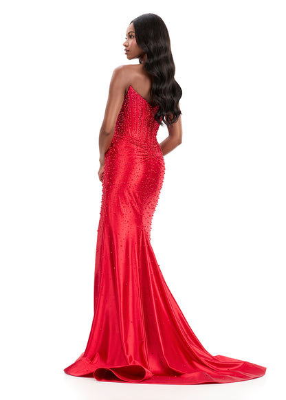 ASHLEYlauren Style 12356 is a fully beaded evening gown that commands attention with its fitted silhouette and strapless neckline.&nbsp; Ashley Lauren 12356 The expertly contoured bodice features vertical beadwork that accentuates the waist and elongates the figure, while a sweeping train with slit adds dramatic movement. Crafted from jersey fabric with pearl corset bustier detailing, this gown delivers high-impact sparkle from every angle. Ideal for pageants, red carpet events, prom, galas, and special occ