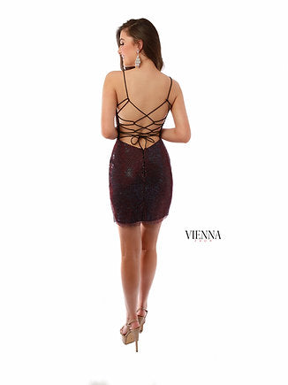 VIENNA Prom 60037 Crystal Net Deep V-Neck Spaghetti Strap Open Back Cocktail Homecoming Dress. This VIENNA Prom dress is crafted from crystal net fabric for a flattering and comfortable fit. The deep V-neckline and spaghetti straps make it perfect for special occasions. The open back design adds an elegant touch. Stand out at any event with this stylish and modern dress.