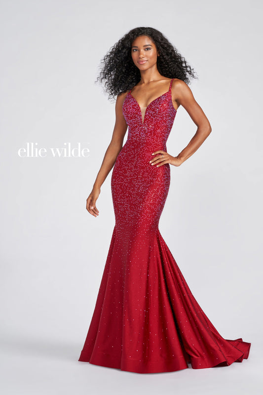 Look stunning in this Ellie Wilde EW120012 prom dress. This gorgeous mermaid-style gown has a backless crystal jersey design and sparkling crystal appliqué detailing that will make you shine on the dance floor. The fitted jersey fabric ensures that you’ll look your best in this dazzling gown. Sleeveless novelty stretch fit and flare gown with a plunging V-neck, natural waist, stone accents throughout gown, open bandeau back, horsehair hem and a sweep train.