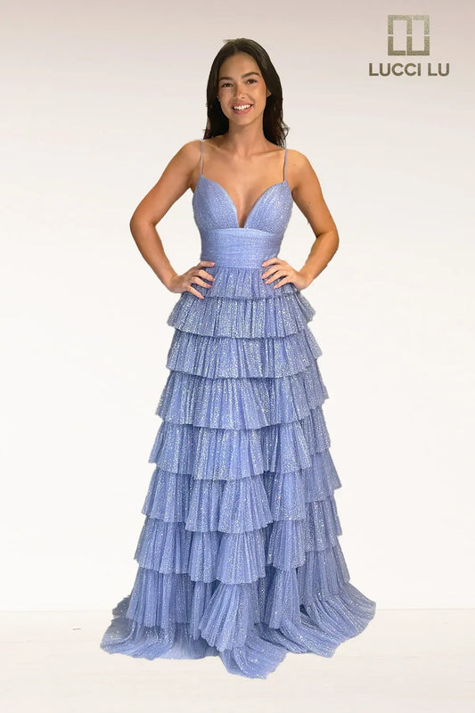 This stunning Lucci Lu 1342 A Line Prom Dress is the perfect choice for any formal event. With its glitter layer and tulle fabric, it exudes elegance and sophistication. The V neck and A line style will flatter any figure, making you feel confident and glamorous. The ruffle detail adds a touch of playful charm. Make a statement with this dress at your next special occasion.  Sizes: 0-24  Colors: Sage, Lilac, Dusty Pink