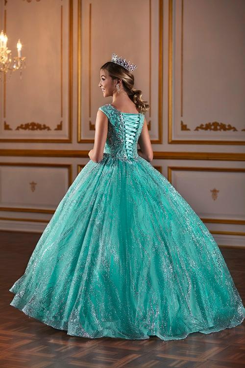 The Tiffany Princess 13575 Pageant Dress is the epitome of elegance. Featuring a high neck and crystal embellishments, this A-line gown exudes sophistication and grace. Made with sparkling glitter and quality materials, it will make any young girl feel like royalty. Perfect for pageants or any formal event.&nbsp;