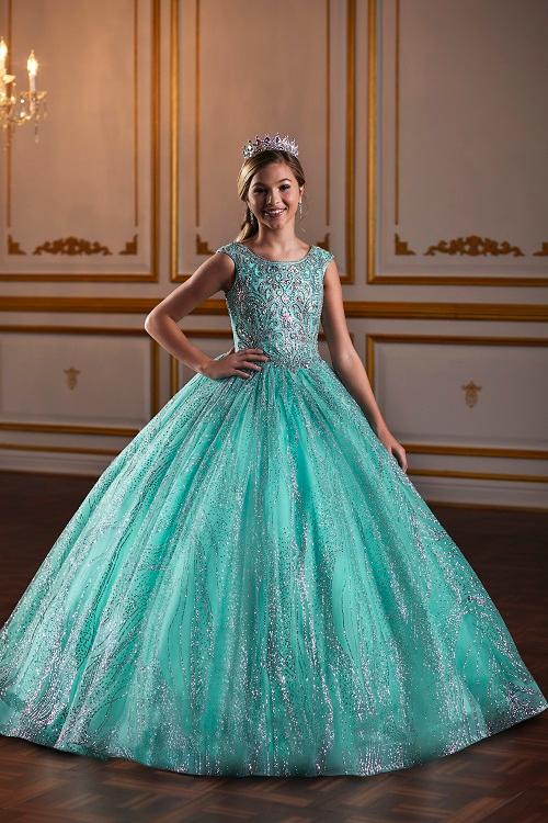 The Tiffany Princess 13575 Pageant Dress is the epitome of elegance. Featuring a high neck and crystal embellishments, this A-line gown exudes sophistication and grace. Made with sparkling glitter and quality materials, it will make any young girl feel like royalty. Perfect for pageants or any formal event.&nbsp;