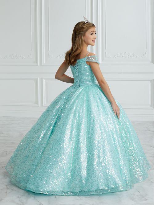 This stunning Tiffany Princess 13679 pageant dress features a dazzling sequin design, off the shoulder neckline, and a full ball gown silhouette, making your little one feel like royalty. Perfect for formal events and pageants, this dress is both elegant and eye-catching.