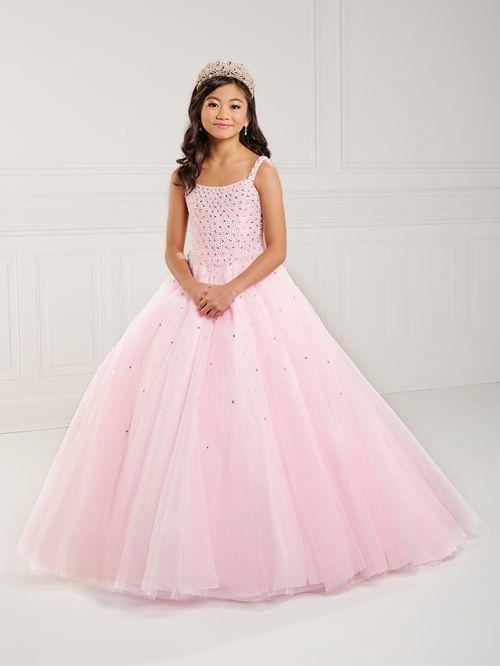 This Tiffany Princess 13739 Girls Pageant Dress is the perfect choice for preteens. The tulle material adds volume to the A-line corset ball gown while the pearl beading adds a touch of elegance. The dress is designed to make your little one stand out on stage. <span data-mce-fragment="1">Square neckline, pearls and Rhinestone fully beaded bodice, and tulle ball gown skirt. Lace-up back and sweep train.</span>]