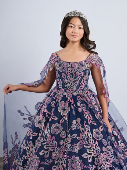 Be the belle of the ball in the Tiffany Princess 13794 Glitter Floral Girls Pageant Dress. This stunning off the shoulder ballgown features a corset bodice and a flowing cape for added drama. The glittering floral details will make you stand out from the crowd. Perfect for any pageant or special occasion.

Sizes: 2-16

Colors: Navy/Multi, Pink/Multi