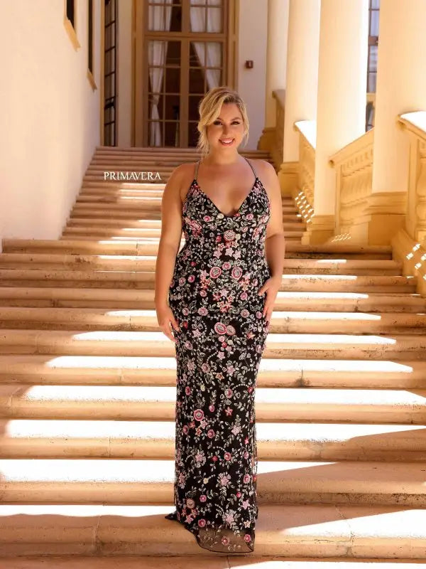 Flaunt your curves in style with the Primavera Couture 14041 Long Prom Dress. This stunning gown features a fitted silhouette, accentuated by beautiful beaded floral details. The V-neckline adds a touch of elegance, making it perfect for any formal occasion. Available in plus sizes for a comfortable and flattering fit. Expertly designed for a statement-making entrance.