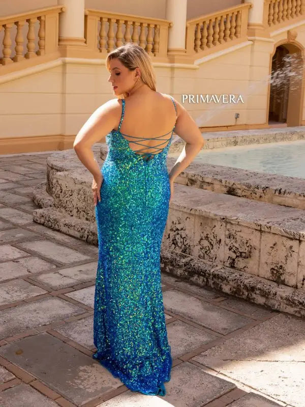 Be the belle of the ball in the Primavera Couture 14042 Long Prom Dress. With a stunning ombre sequin design, fitted corset bodice, and scoop neck, this formal gown will make you stand out. Feel confident and beautiful in this plus size dress, perfect for any formal occasion.