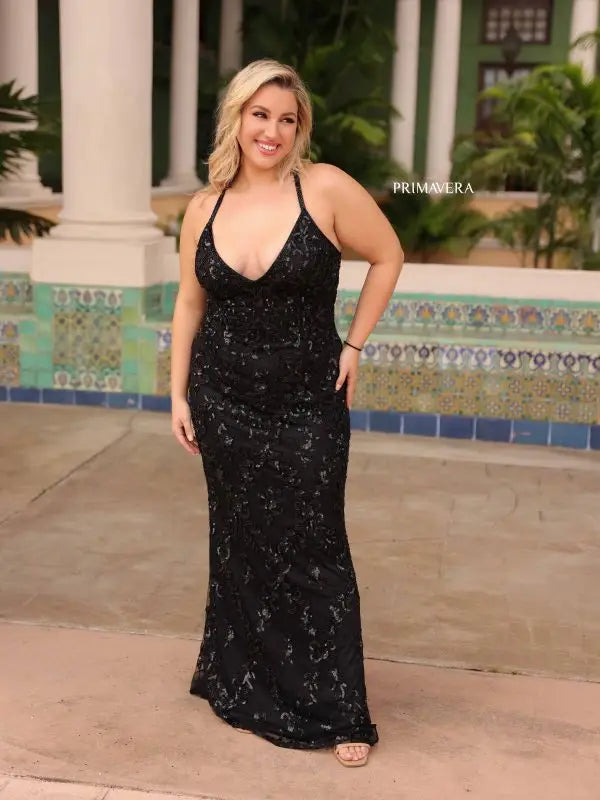 Elevate elegance with this Primavera Couture 14043 Long Prom Dress. Dazzling sequins, a fitted design, and criss-cross detailing accentuate your curves and add a touch of sparkle. The v-neckline elongates the neckline, making this gown perfect for formal events. Stand out from the crowd with this plus size beauty.