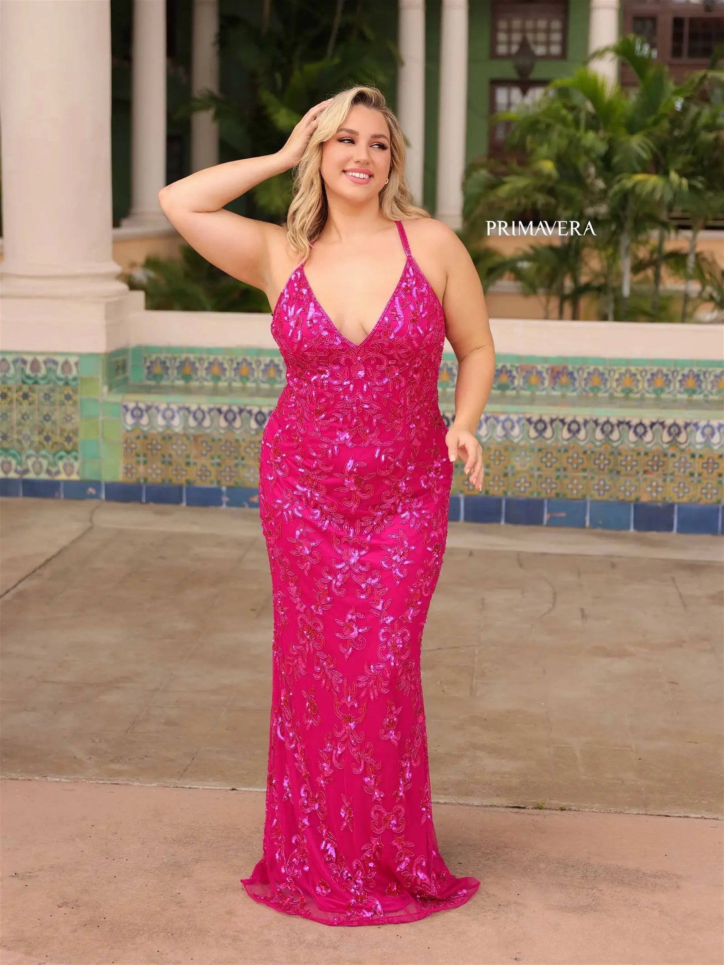 Elevate elegance with this Primavera Couture 14043 Long Prom Dress. Dazzling sequins, a fitted design, and criss-cross detailing accentuate your curves and add a touch of sparkle. The v-neckline elongates the neckline, making this gown perfect for formal events. Stand out from the crowd with this plus size beauty.