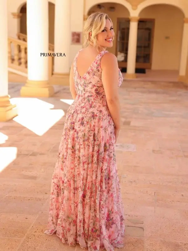 Elevate your style with the Primavera Couture 14046 Long Prom Dress. This stunning plus size gown features a beautiful floral print and elegant beaded detailing along the V-neckline. Perfect for any formal occasion, this dress is sure to make you stand out and feel confident.