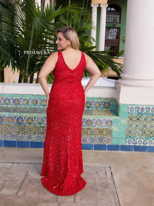 Get ready to dazzle in style with the Primavera Couture 14048 Long Prom Dress. This stunning plus size gown features a fitted sequin design on a V-neckline, perfect for any formal occasion. Make a statement and stand out from the crowd in this glamorous and figure-flattering dress.