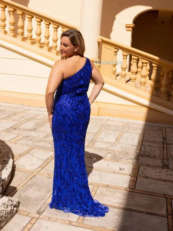 This Primavera Couture 14049 Long Prom Dress exudes glamour and sophistication. Designed with sequins for a touch of sparkle, this plus size formal gown hugs your curves in all the right places. Elevate your prom or formal event with this elegantly fitted dress.