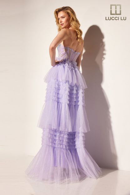 Stay elegant with the Lucci Lu 1408 Sheer Crystal Corset A Line Pleated Ruffle Prom Dress Layer Formal Ballgown. The strapless design enhances femininity while the sheer crystal corset adds a touch of glamour. The pleated ruffle and A-line silhouette create a flattering look for any formal event.

Sizes: 00-12

Colors: Lilac, Mint