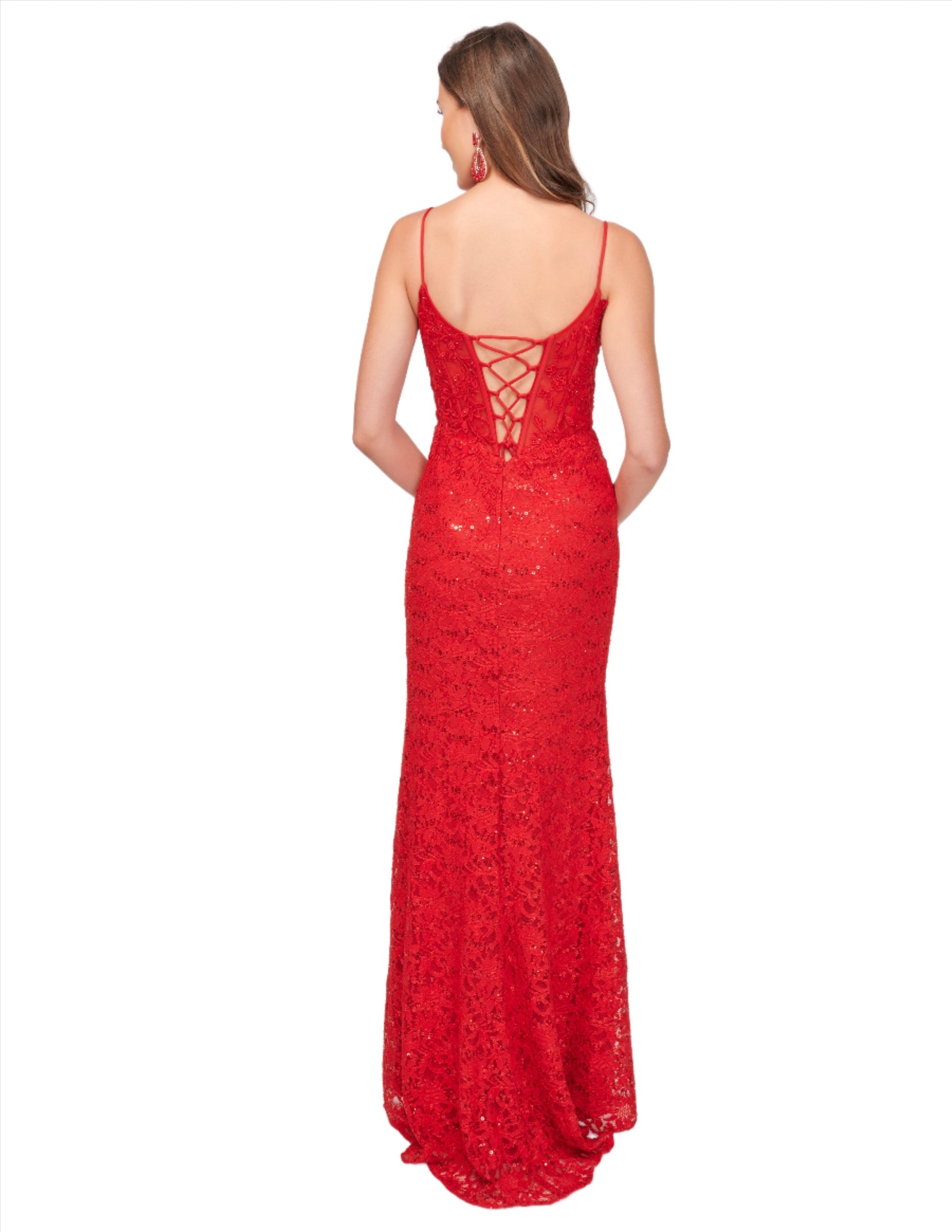 Elevate your evening look with the Nina Canacci 1568 formal dress. Featuring a sheer lace corset and a striking sequin crystal V neck, this dress exudes elegance and sophistication. The corset detail cinches the waist for a flattering silhouette, while the slit adds a touch of sultry appeal. Perfect for prom or any formal event.
