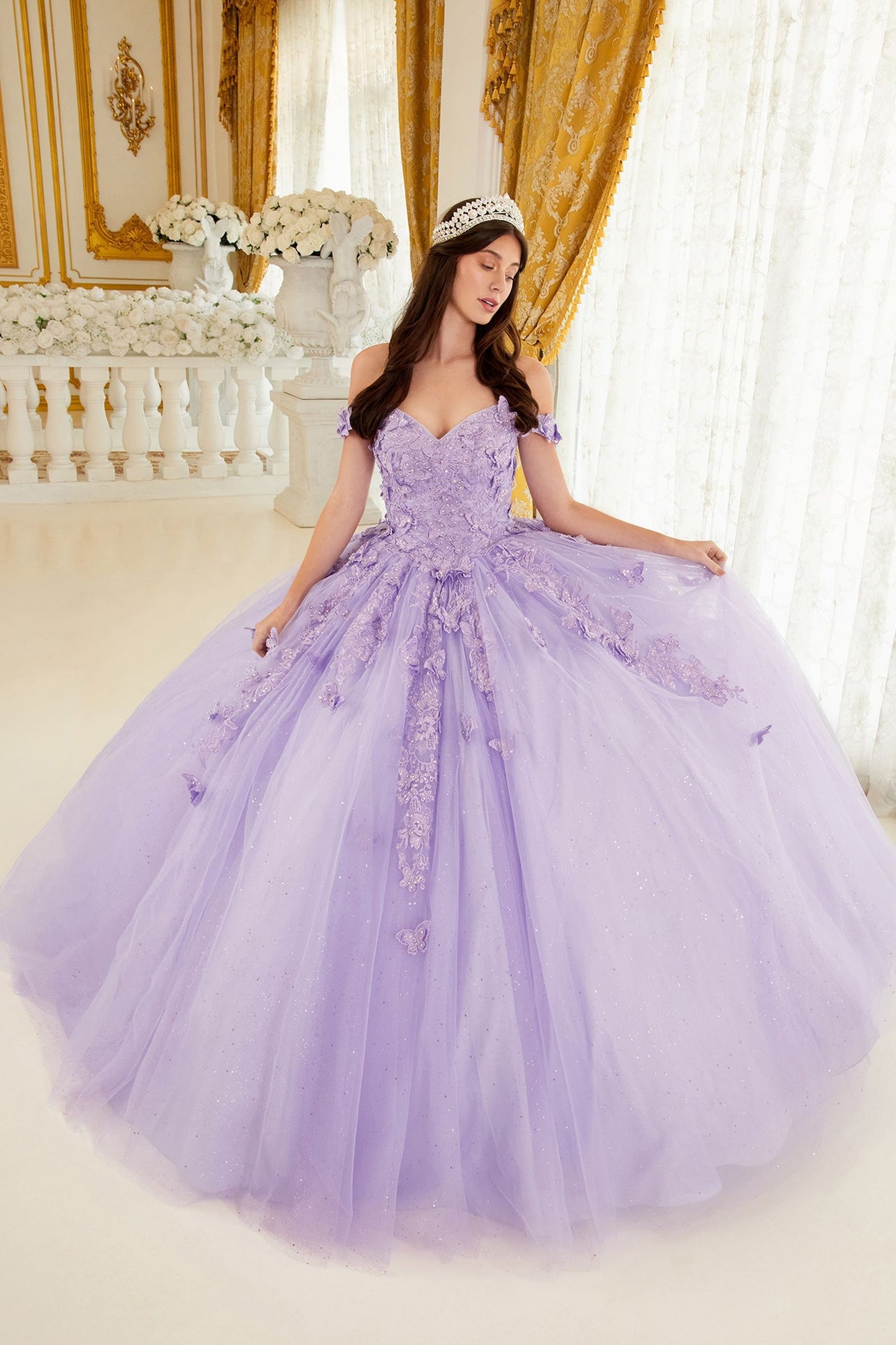 The Ladivine 15709 quinceanera dress will have you feeling like royalty! This stunning ballgown features a shimmery off-the-shoulder neckline with a corset lace-up and train - perfect for making a grand entrance! Now if just Cinderella could catch a break... Step into a dream wearing this beautiful off the shoulder butterfly ball gown! 