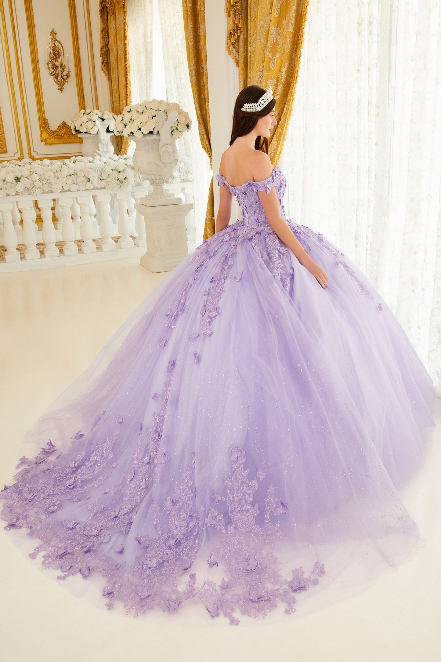 The Ladivine 15709 quinceanera dress will have you feeling like royalty! This stunning ballgown features a shimmery off-the-shoulder neckline with a corset lace-up and train - perfect for making a grand entrance! Now if just Cinderella could catch a break... Step into a dream wearing this beautiful off the shoulder butterfly ball gown! 