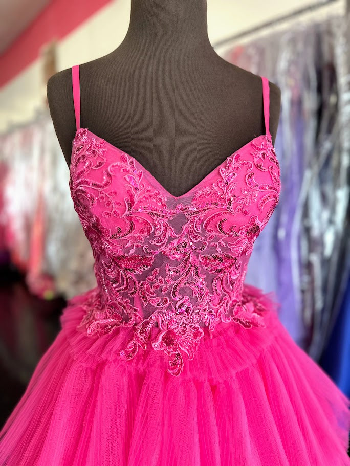 Elevate your formal occasion with the Nina Canacci 1582 ballgown in vibrant fuchsia. This size 4 gown features a sheer lace corset that beautifully contours the silhouette, complemented by delicate pleated ruffles cascading into an elegant A-line skirt. Designed for timeless sophistication, it offers a graceful blend of structure and softness, perfect for making a memorable entrance at prom or any special event.

Size: 4

Color: Fuchsia