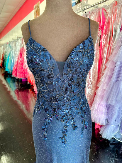 The Nina Canacci 1591 in size 4 is a navy long fitted evening gown designed with shimmering sequins and delicate lace accents. This elegant dress contours the body for a flattering silhouette, making it an excellent choice for prom or as a sophisticated mother-of-the-bride gown. Its refined details and luxurious fabric ensure a polished, graceful appearance for any formal occasion.

Size: 4

Color: Navy
