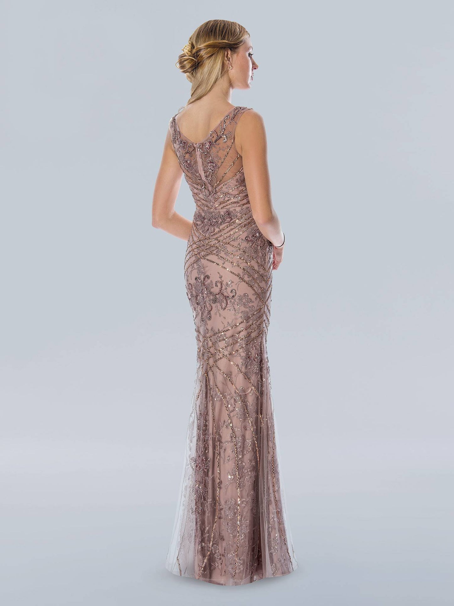 Stella Couture 21048 Long beaded Rhinestone embellished formal dress prom pageant. Stella Couture's 21048 Long Shimmer Beaded Evening Dress is the perfect choice for formal occasions. Crafted with intricate beadwork detail, this figure-flattering gown features a full length design with a classic scoop neckline and tulle-lined skirt for added movement. A breathtaking choice for these special occasions.