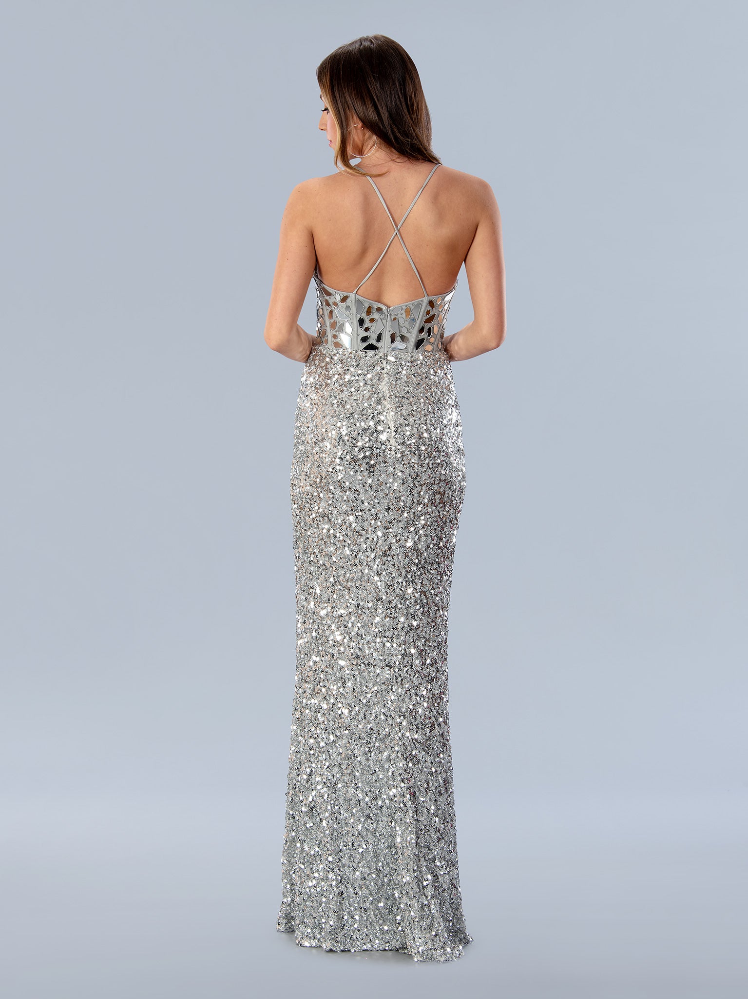 Look breathtaking in Stella Couture 24161. This floor-length dress features a V-neckline and a sparkling sequin-cut corset bodice. The long, A-line skirt features a high slit for a touch of allure. Perfect for formal prom events or special occasions.  Sizes: 0-24  Colors: BLACK, RED, SILVER
