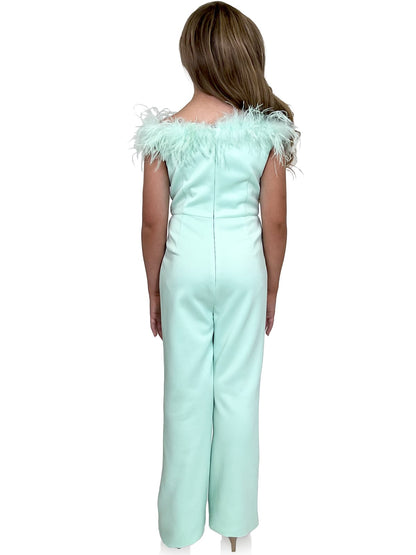 Marc Defang 8185K Pageant Jump suite with feather neck line off the shoulder  Feather neckline Scuba body material Jumpsuit style Center back invisible zipper Fully Lined  Available Sizes: 2-14  Available Colors: Pink, Lilac, Red, White, Royal Blue, Hot Pink, Aqua, Yellow, Emerald, Mint