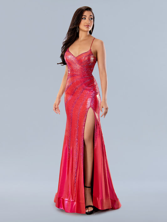 This elegant long gown from Stella Couture 24149 features a sleek metallic fabric, a v-neckline, and a dramatic slit. Intricately designed with a sparkling crystal pattern, this gown is perfect for any formal occasion.  Sizes: 0-24  Colors: Red, Royal
